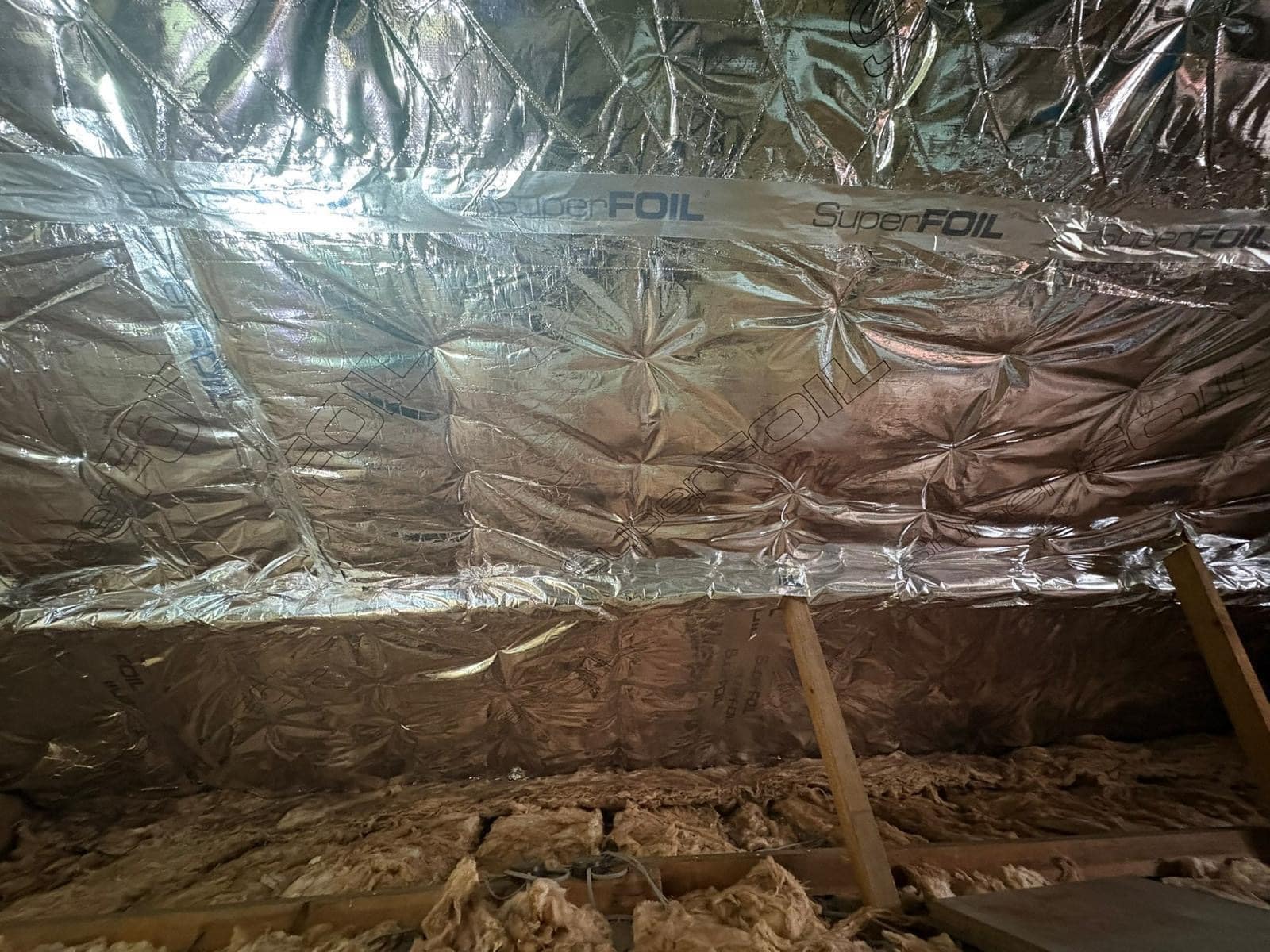 Inetrior shot of loft showing Superfoil Loft Insulation installed by Universal Eco Homes loft insulation installers